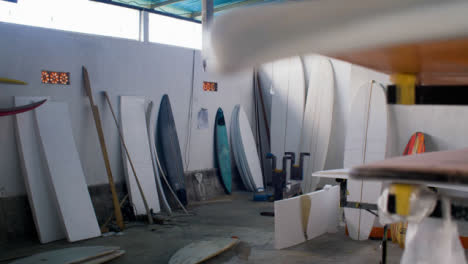 Handheld-Pedestal-Shot-of-Surfboard-Workshop