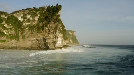 Drone-Shot-Flying-Over-Waves-at-Shore-of-Uluwatu