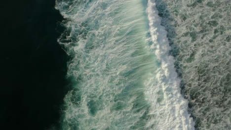 Drone-Shot-Rotating-Above-Waves-Off-Coast-of-Uluwatu-