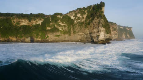 Drone-Shot-Flying-Over-Waves-at-Coast-of-Uluwatu