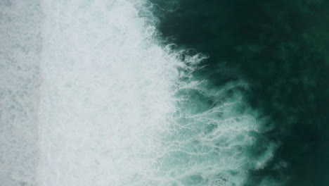 Drone-Shot-Looking-Down-at-Uluwatu-Coast-Waves