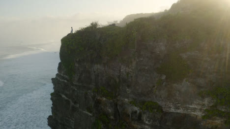 Drone-Shot-Rising-Up-Uluwatu-Coast-Cliff-Face-