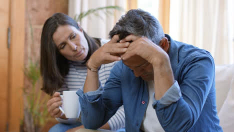 Medium-Shot-of-Middle-Aged-Woman-Comforting-Worried-Husband