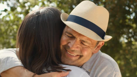 Close-Up-Shot-of-Two-Middle-Aged-Friends-Hugging-and-Embracing