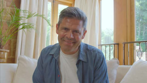 POV-Shot-of-Middle-Aged-Man-Listening-and-Talking-into-Camera-During-Video-Call