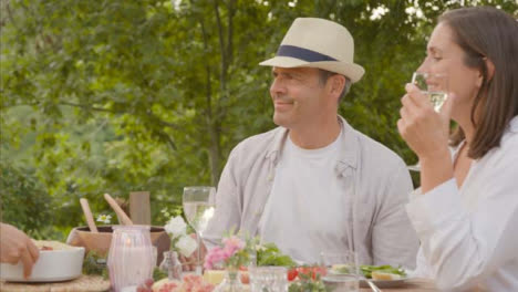 Wide-Shot-of-Middle-Aged-Couple-Thanking-Off-Screen-Waitress-for-Bringing-Bread-to-Table