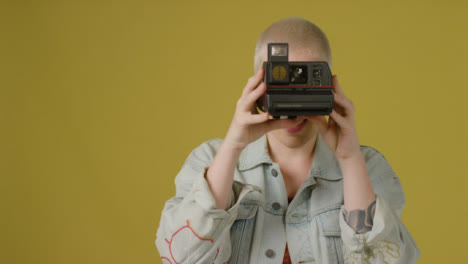 Portrait-Shot-of-Model-Using-Instant-Film-Camera-