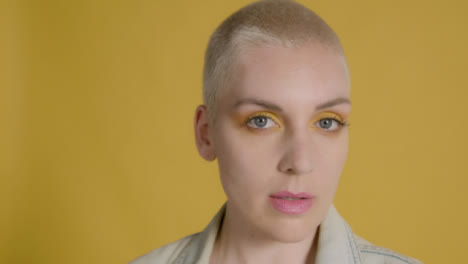 Close-Up-Shot-of-Model-Posing-In-Front-of-Yellow-Backdrop