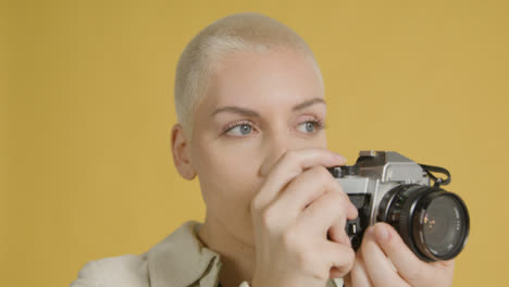 Woman-takes-photograph-on-vintage-camera-04