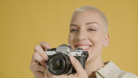 Smiling-Woman-Takes-Photograph-on-Vintage-Camera-02