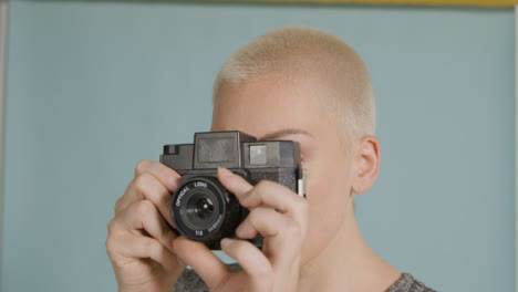 Female-photographer-poses-with-vintage-camera-05