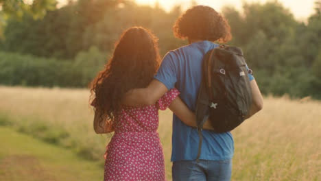 Tracking-Shot-Following-Hetrosexual-Couple-Walking-at-Sunset