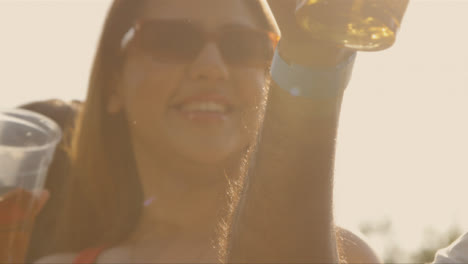 Close-Up-Shot-of-Two-Girls-at-Festival-Stage-Barrier-Enjoying-Music