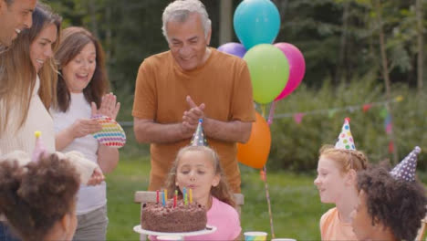 Medium-Shot-of-Family-and-Friends-Celebrating-Child's-Birthday-Party