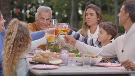 Medium-Shot-of-Family-Eating-Dinner-at-Outdoor-Table