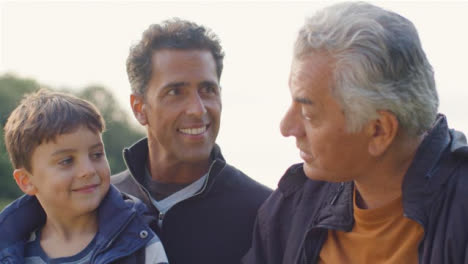 Close-Up-Shot-of-Grandfather,-Father-and-Son-Talking-01