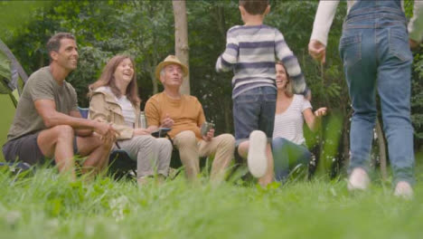 Low-Angle-Shot-of-Children-Joining-Their-Family-On-Camping-Trip
