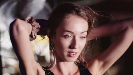 Slow-Motion-Of-Smiling-Attractive-Female-Athlete-Moving-Hands-Through-Hair-At-Health-Club-5