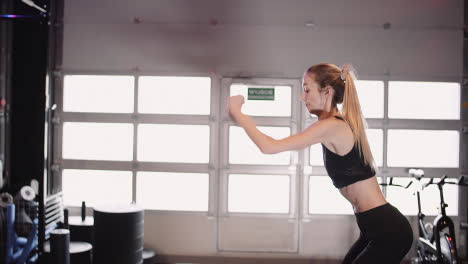 Slow-Motion-Of-Fit-Young-Woman-Doing-Box-Jump-Exercise-At-Health-Club