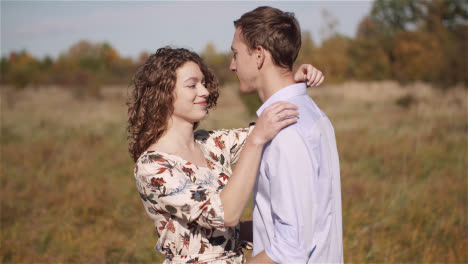 Loving-Couple-Walking-On-A-Meadow-In-Summer-19