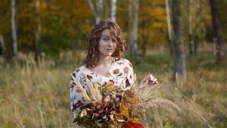 Medium-Shot-Of-Woman-Looking-At-Bouquet-Of-Wild-Flowers-In-Summer-1