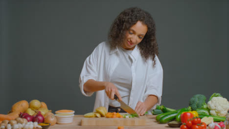 Wide-Shot-of-Young-Adult-Woman-Slicing-Spring-Onion