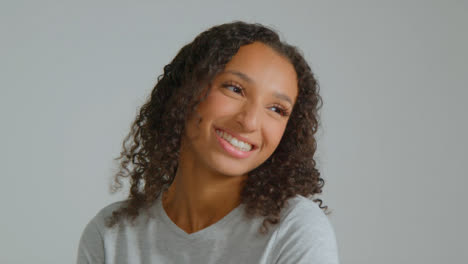 Tracking-Shot-Approaching-Young-Adult-Woman-Smiling-Off-Camera