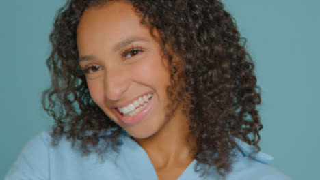Close-Up-Shot-of-Young-Adult-Woman-Smiling-Off-Camera