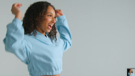 Side-Profile-Shot-of-Young-Adult-Woman-Smiling-and-Dancing-with-Copy-Space