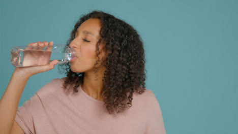 Portrait-Shot-of-Young-Adult-Woman-Drinking-from-Water-Bottle-05