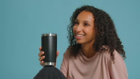 Medium-Shot-of-Young-Adult-Woman-with-Flask-Having-Conversation-02