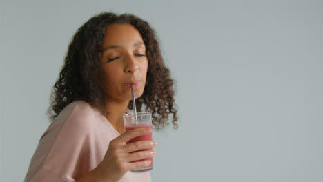 Side-Profile-Shot-of-Young-Adult-Woman-Drinking-Smoothie-with-Copy-Space-02