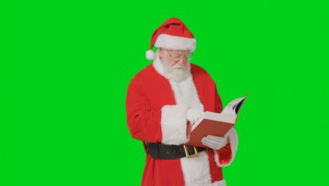 Portrait-Shot-of-Santa-Holding-Reading-Through-a-Big-Red-Book