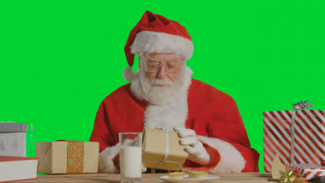 Portrait-Shot-of-Santa-Organising-Presents-and-Gifts