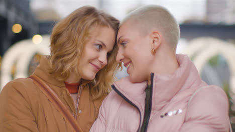 Close-Up-Shot-of-Two-Young-Women-Holding-One-Another