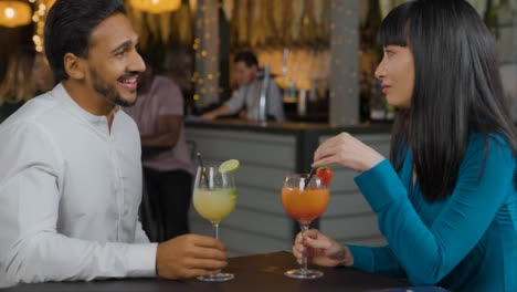 Tracking-Shot-of-Man-and-Woman-Talking-In-a-Bar