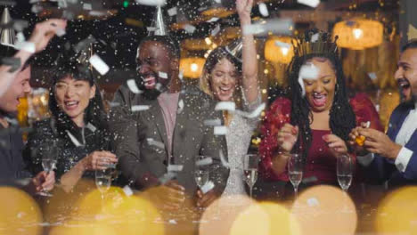 Wide-Shot-of-Friends-Celebrating-New-Year's-Eve-with-Confetti