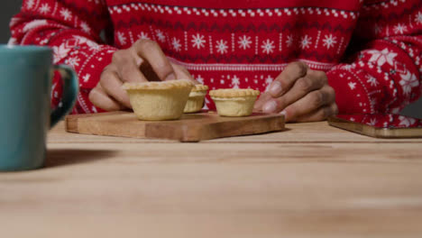 Tracking-Shot-of-Young-Man-Eating-Mince-Pie