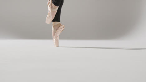 Close-Up-Shot-of-Ballet-Dancers-Feet-Dancing-and-Her-Smiling