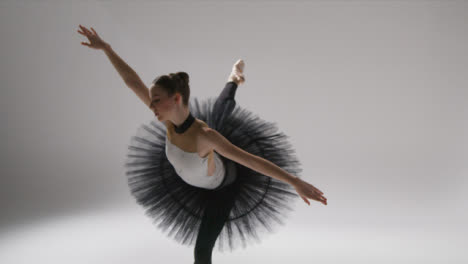 Tracking-Shot-of-a-Ballerina-Stretching-and-Dancing