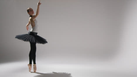 Wide-Shot-of-Ballerina-on-Pointe-with-Copy-Space