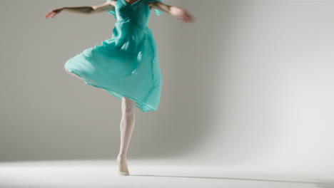 Low-Angle-Shot-of-Young-Ballet-Dancer-Twirling