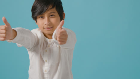 Mid-Shot-of-Little-Boy-Putting-His-Thumbs-up-with-Copy-Space