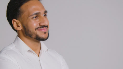 Portrait-Shot-of-a-Young-Man-Smiling-Away-From-Camera-with-Copy-Space