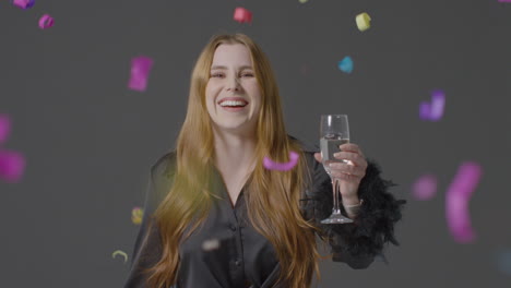 Medium-Shot-of-Young-Woman-Saying-Happy-New-Year-and-Toasting-Her-Glass