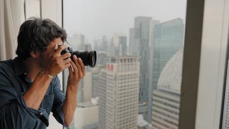 Mid-Shot-of-Man-Taking-Photos-of-Jakarta