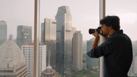 Long-Shot-of-a-Man-Taking-Pictures-of-Jakarta