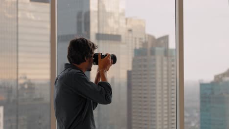 Long-Shot-of-a-Man-Taking-Photos-in-Window