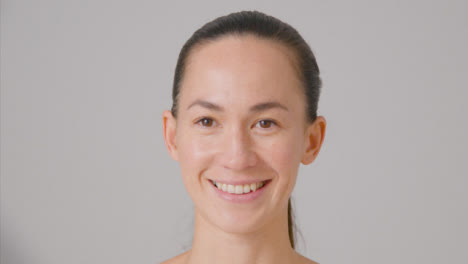 Close-Up-Shot-of-a-Young-Woman-Smiling