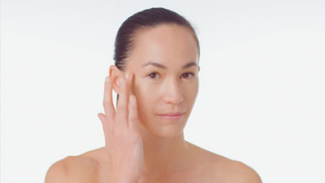 Mid-Shot-of-Young-Woman-Blending-Concealer-with-Finger